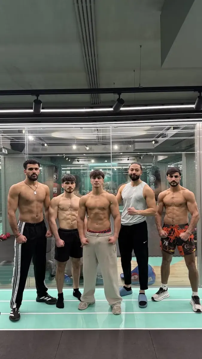 Combat athletes and coach during fight preparation