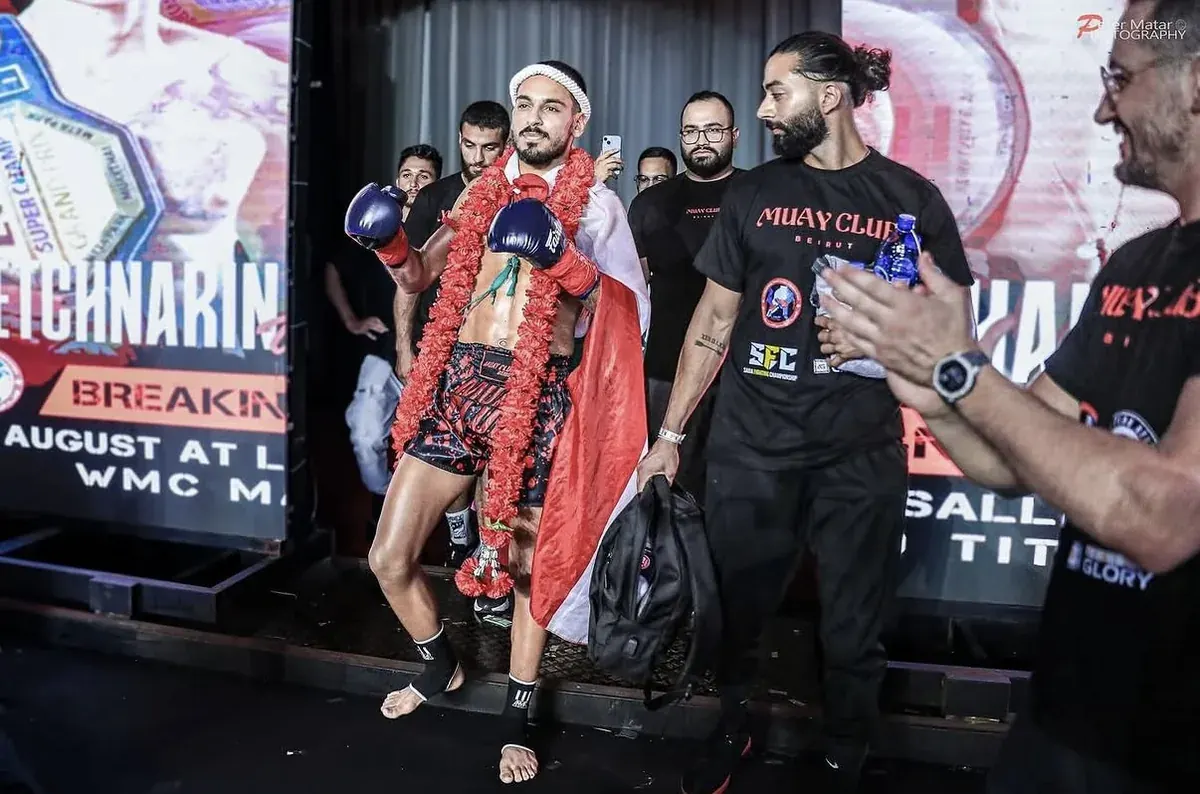 Fight-night support walking out with a combat athlete